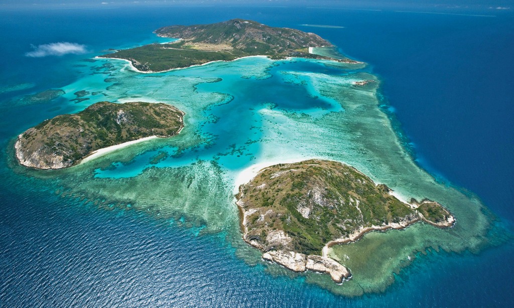 Photograph of Lizard Island. You can see the fringing reef bordering the island from above.